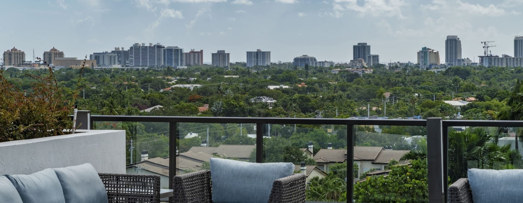 wide view of city skyline and local community from  an outdoor patio